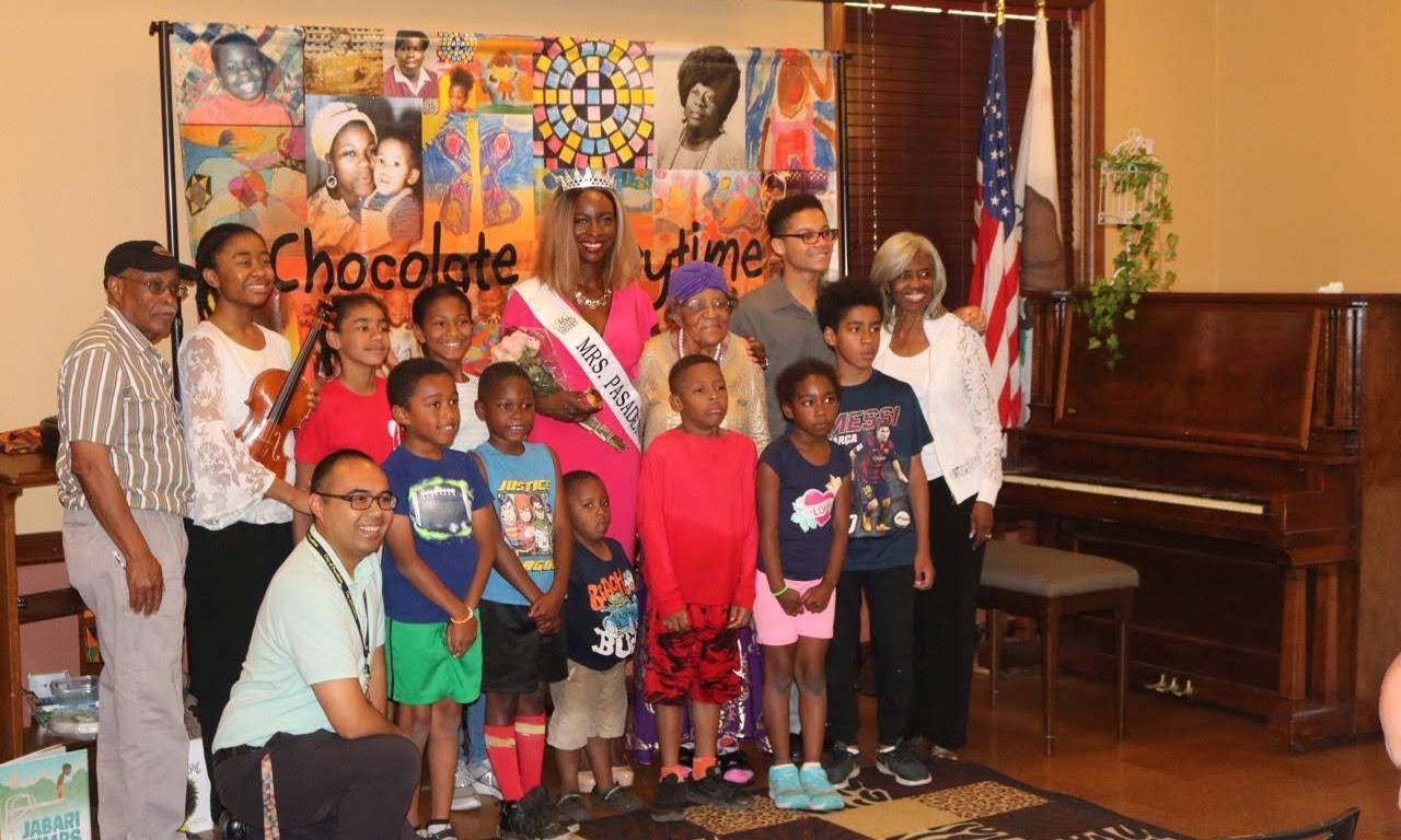 Mrs. Pasadena poses with kids and guests of Chocolate Storytime